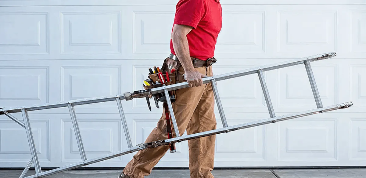 Garage door repair technician arriving with tools and ladder in Richmond, VA